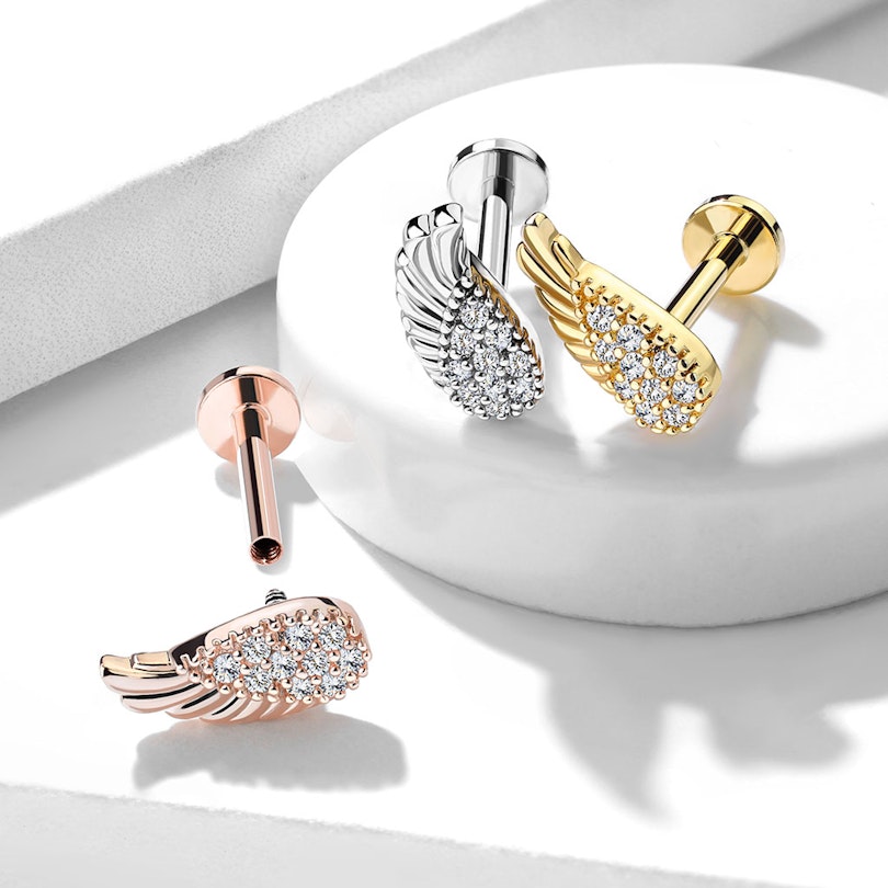 Labret em forma de asa de anjo com imensas pedras