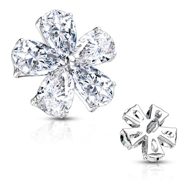 Micro dermal topo em forma de flor com pedras formando as folhas