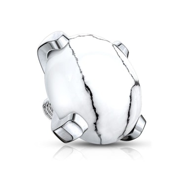 Topo de dermal com gemas presas com 4 garras