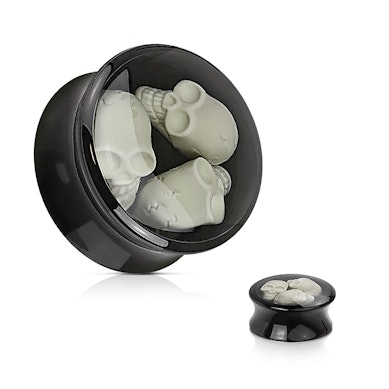Plug de acrílico com três caveiras