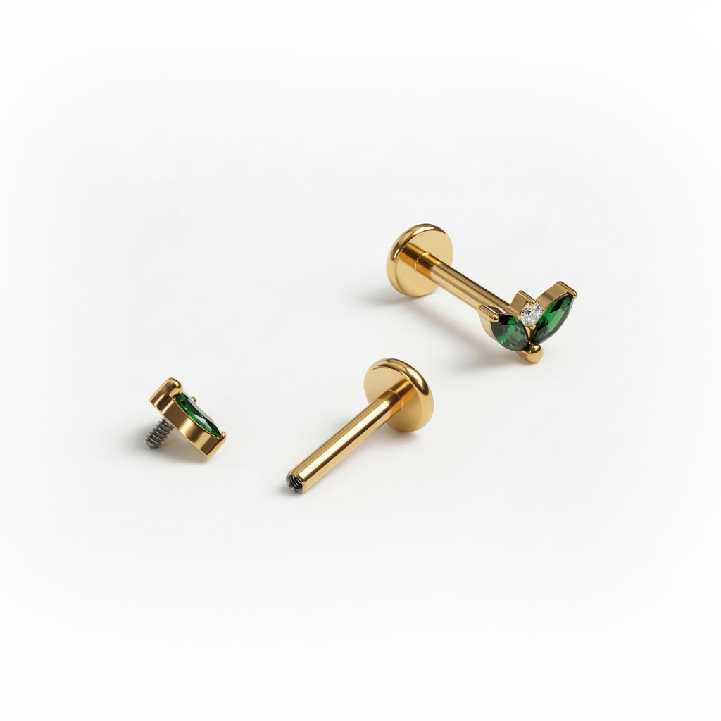 Labret em titânio com duas pedras esmeralda