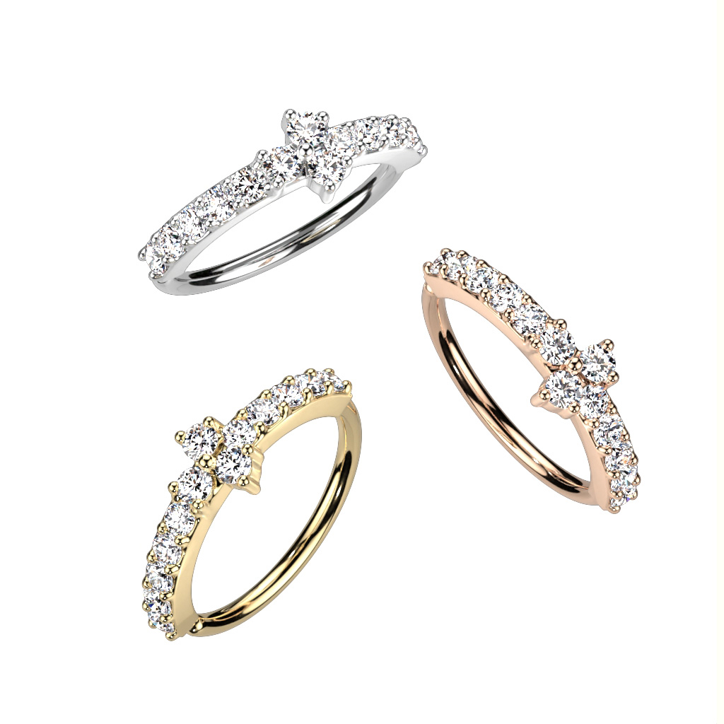 Argola com torção com pedras a ladear e uma pedra triangular no centro